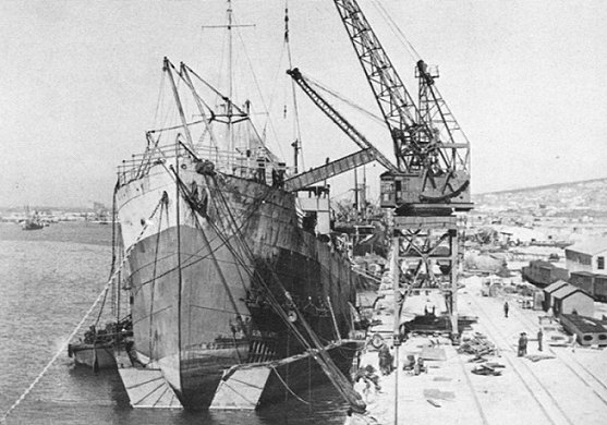 Mangkalihat under repairs in Capetown. Note the pontoon under the bow and the damage to the bow section