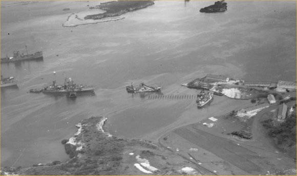 Parera naval base on the left. On the left, the wreck of the sloop USS Erie is brought in. Picture from the National Archives kindly provided by Jon Balson.